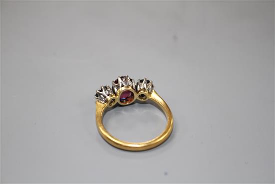 A 1930s 22ct gold, garnet and sapphire? three stone dress ring,